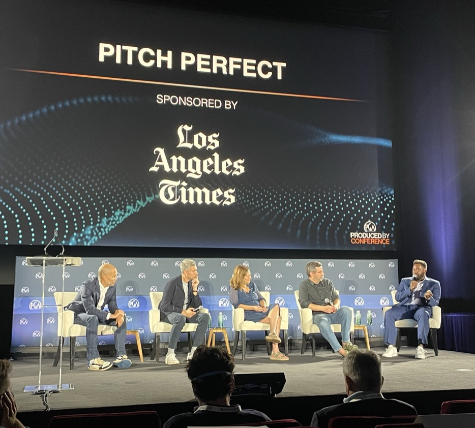 Aspen Powers speaking onstage during Pitch Perfect at the Produced By Conference